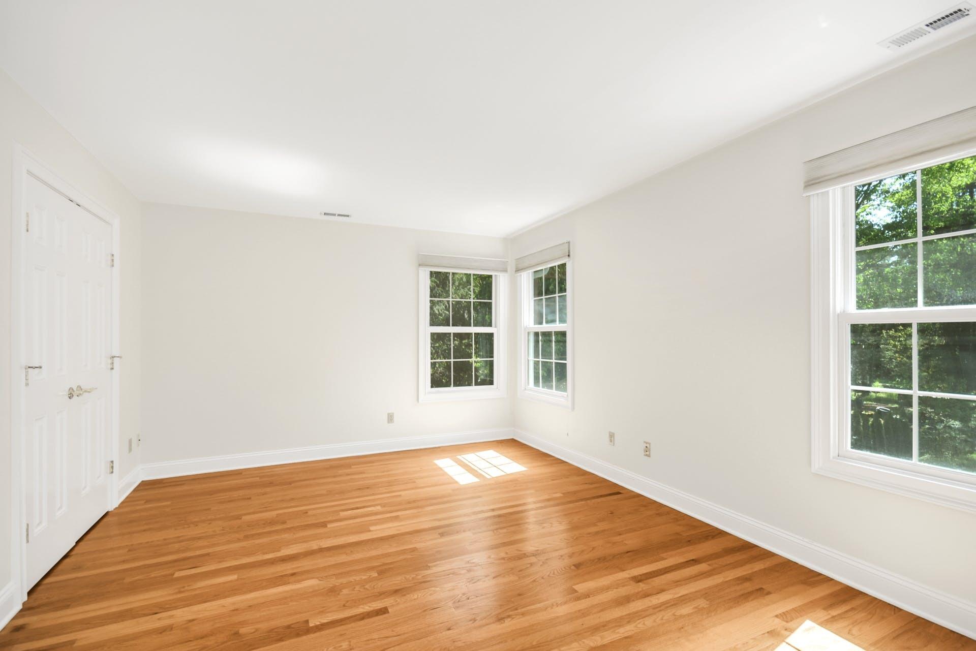 5 Christopher Lane Norwalk, CT 06851 - Photo 27 of 46 a view of empty room with wooden floor and fan