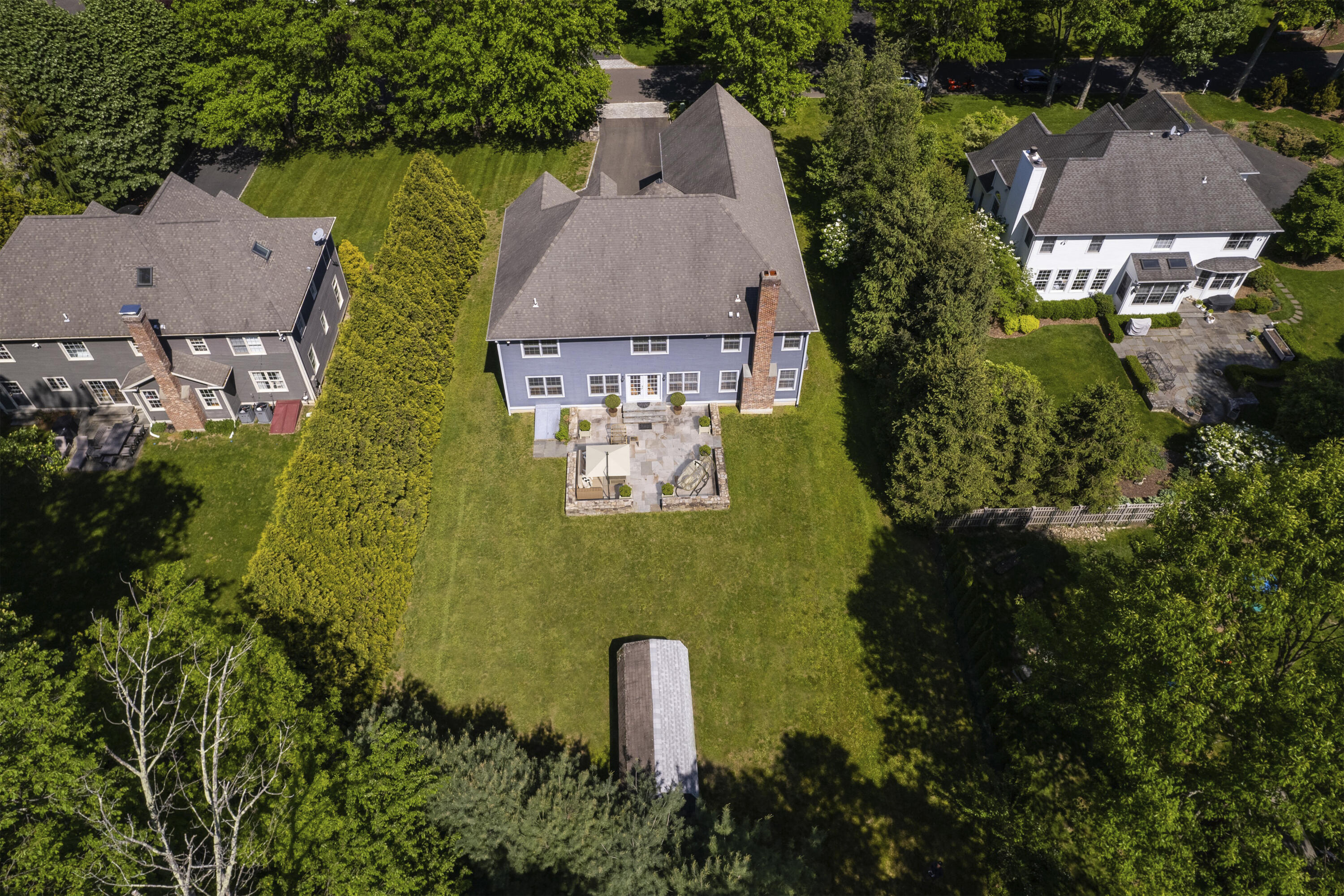 5 Christopher Lane Norwalk, CT 06851 - Photo 33 of 46 an aerial view of a house with a garden and swimming pool
