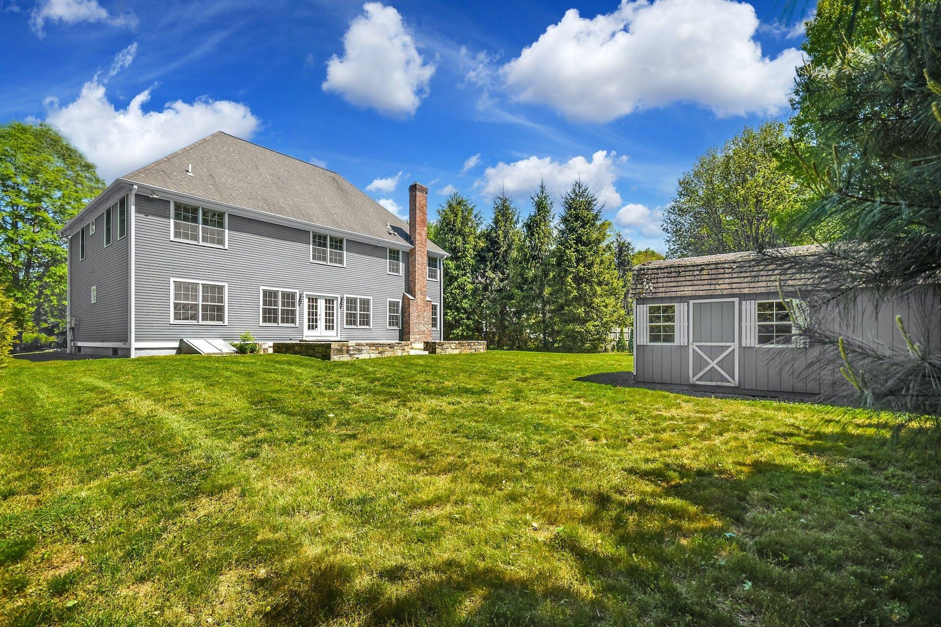 5 Christopher Lane Norwalk, CT 06851 - Photo 38 of 46 a front view of a house with a yard