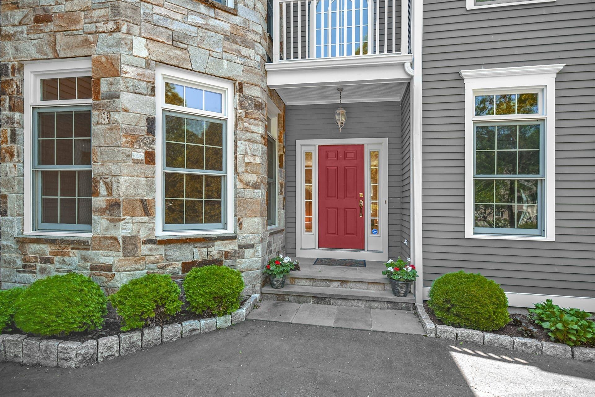 5 Christopher Lane Norwalk, CT 06851 - Photo 4 of 46 a front view of a house with a yard and outdoor seating