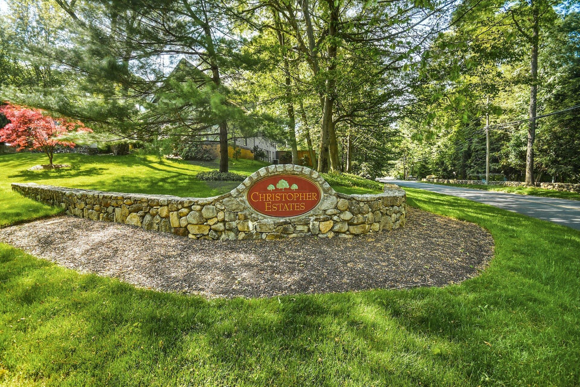 5 Christopher Lane Norwalk, CT 06851 - Photo 43 of 46 a backyard of a house with a yard and outdoor seating