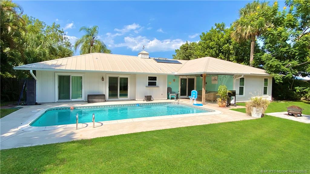 323 Southwest Ridge Lane Stuart, FL 34994 - Photo 2 of 29 a view of a house with a yard patio and swimming pool