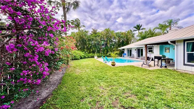 a view of a swimming pool with a patio