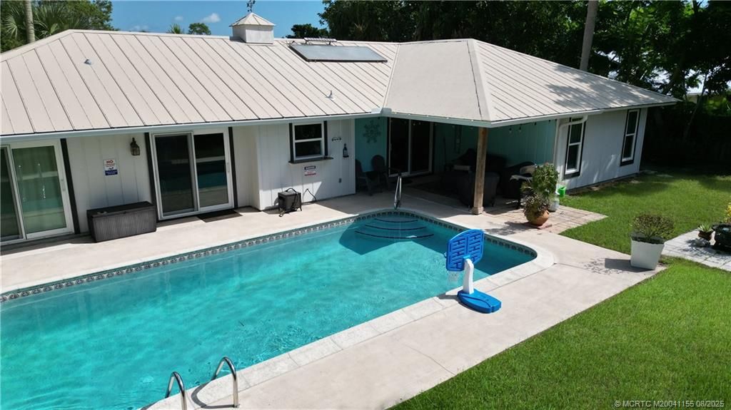 323 Southwest Ridge Lane Stuart, FL 34994 - Photo 3 of 29 a view of a house with backyard porch and sitting area