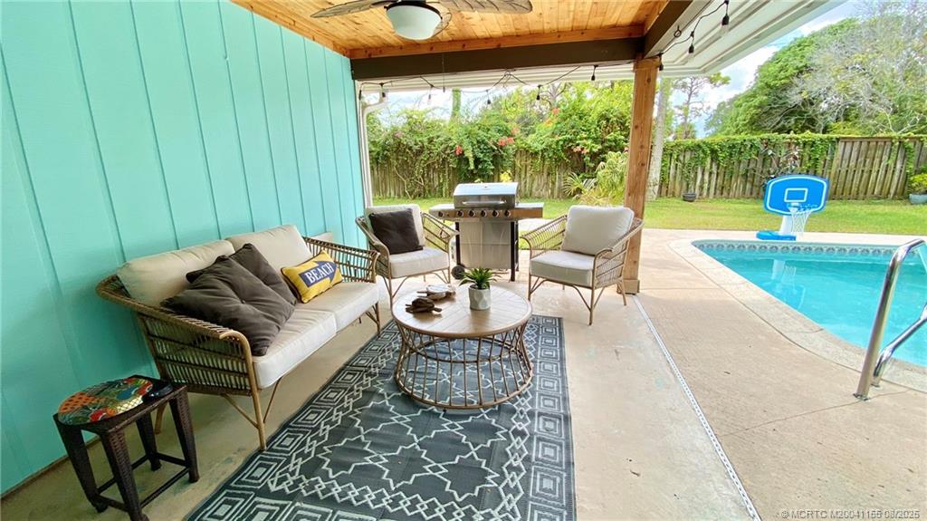 323 Southwest Ridge Lane Stuart, FL 34994 - Photo 5 of 29 a outdoor space with patio the couches and a dining table with garden view