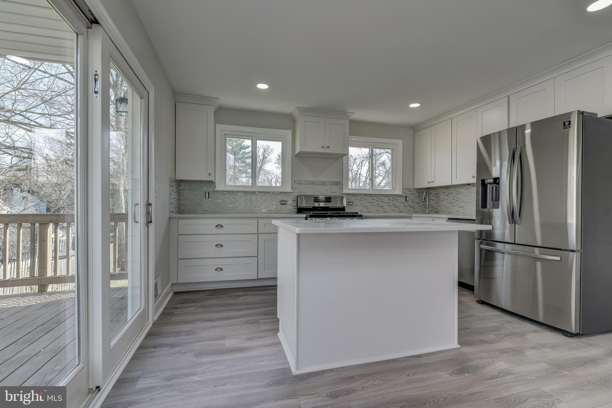 910 Robin Road Silver Spring, MD 20901 - Photo 9 of 49 Gourmet Kitchen Leading to Deck