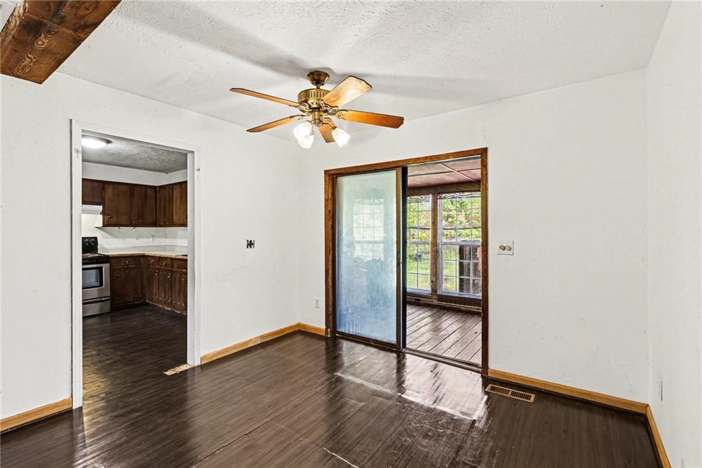 4365 Carrollton Villa Rica Highway Villa Rica, GA 30180 - Photo 25 of 30 a view of a hallway with wooden floor and a bathroom