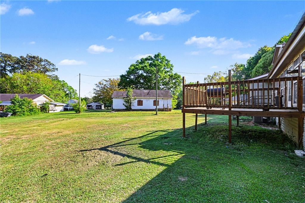 4365 Carrollton Villa Rica Highway Villa Rica, GA 30180 - Photo 29 of 30 a view of an house with backyard and a tree
