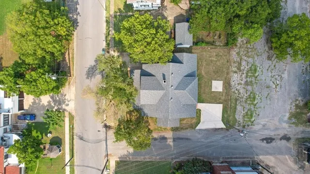 an aerial view of a house with outdoor space