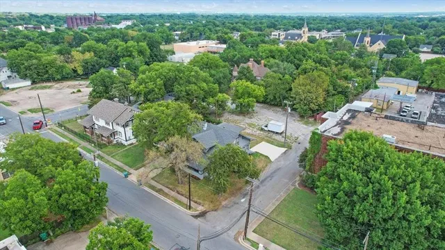 an aerial view of a house with outdoor space