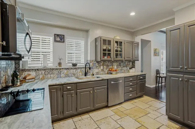 a kitchen with a sink stove and refrigerator