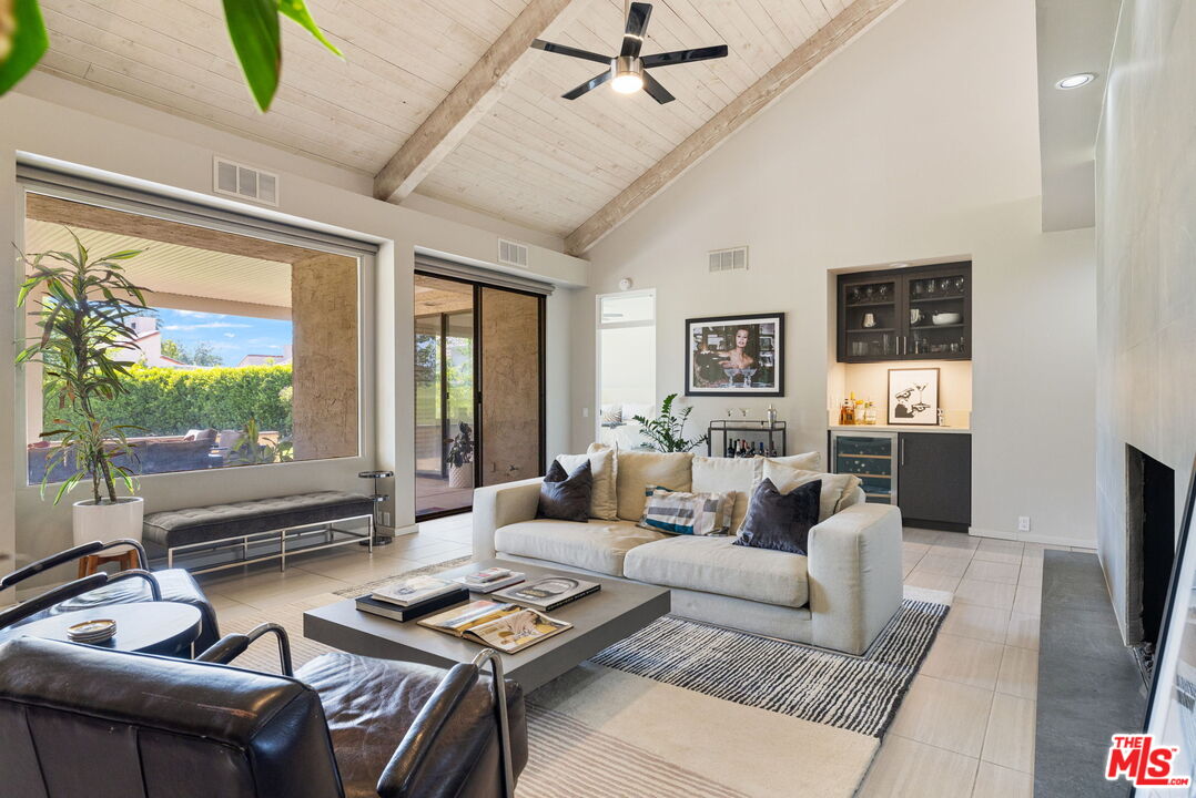155 Desert W Drive Rancho Mirage, CA 92270 - Photo 12 of 50 a living room with furniture and a flat screen tv