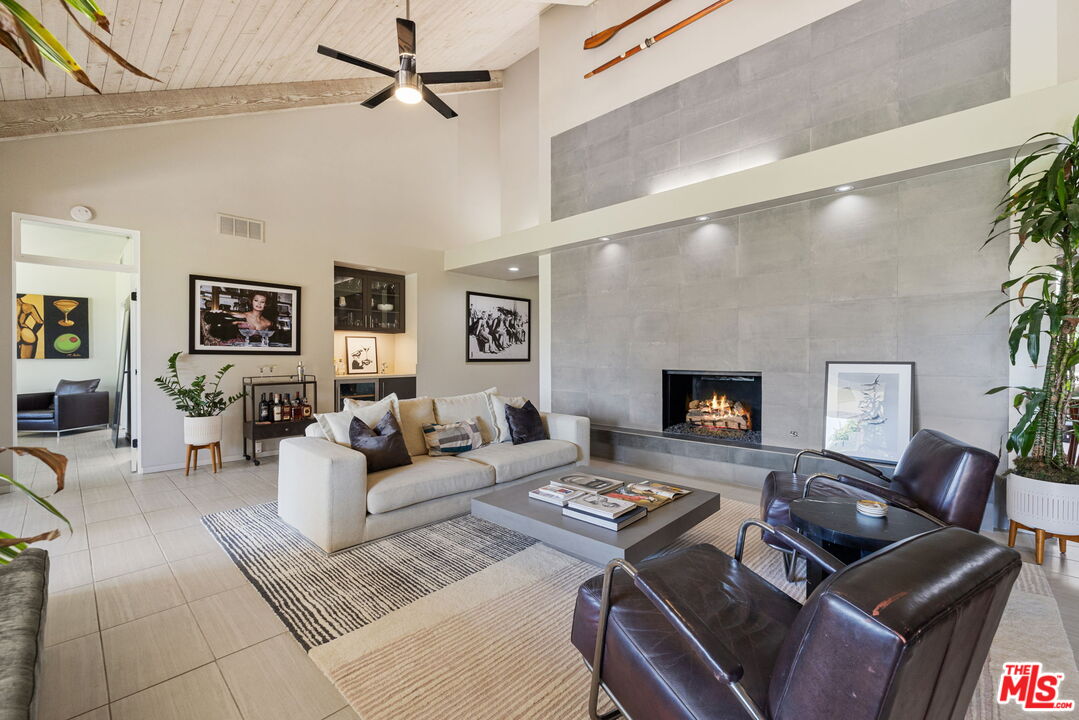 155 Desert W Drive Rancho Mirage, CA 92270 - Photo 13 of 50 a living room with furniture and a fireplace