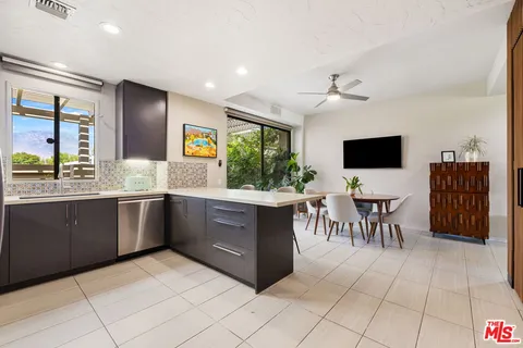 a kitchen with a sink stove and microwave