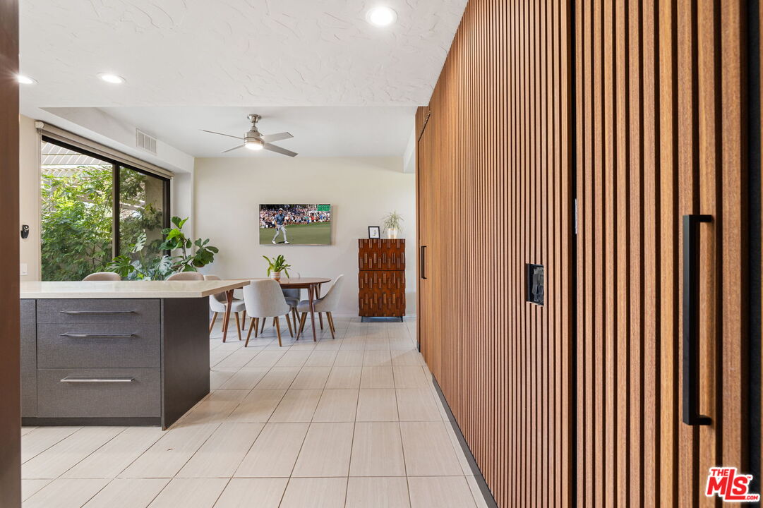 155 Desert W Drive Rancho Mirage, CA 92270 - Photo 26 of 50 a view of a hallway with furniture and front door