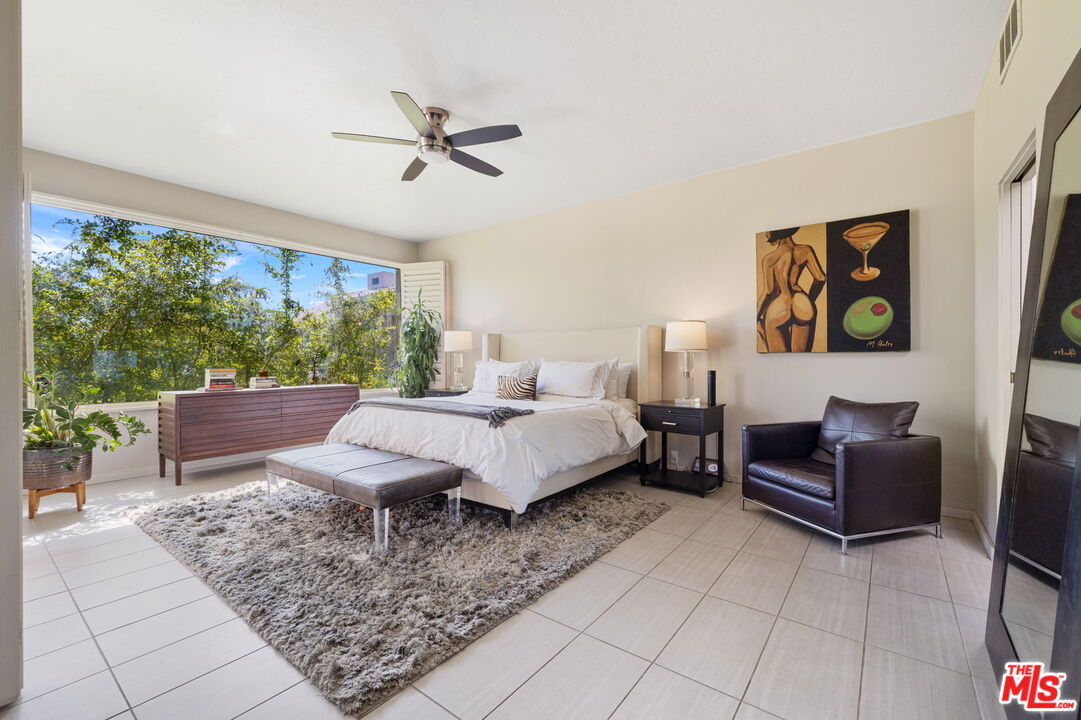 155 Desert W Drive Rancho Mirage, CA 92270 - Photo 27 of 50 a living room with furniture and a large window