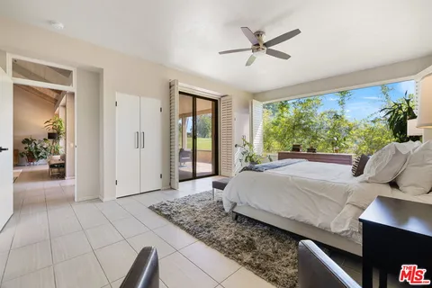 a large kitchen with a table and chairs