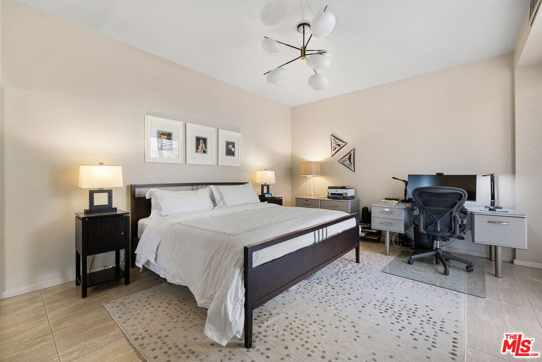 155 Desert W Drive Rancho Mirage, CA 92270 - Photo 35 of 50 a bedroom with a bed a desk and chair