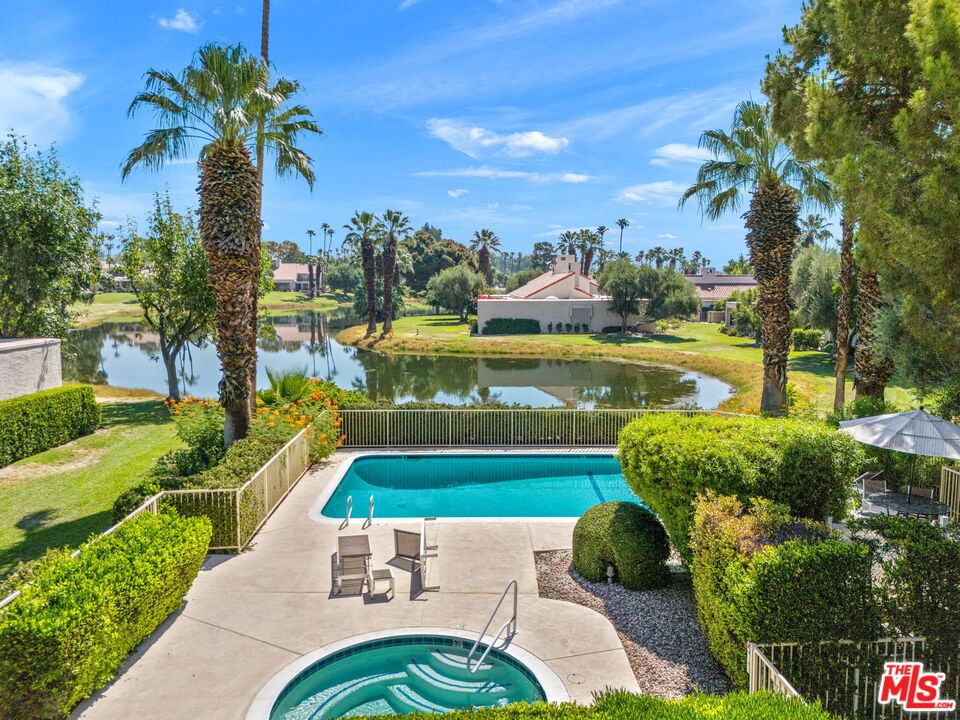 155 Desert W Drive Rancho Mirage, CA 92270 - Photo 46 of 50 a view of a swimming pool with a patio