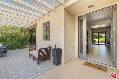 a view of outdoor space with porch and wooden floor