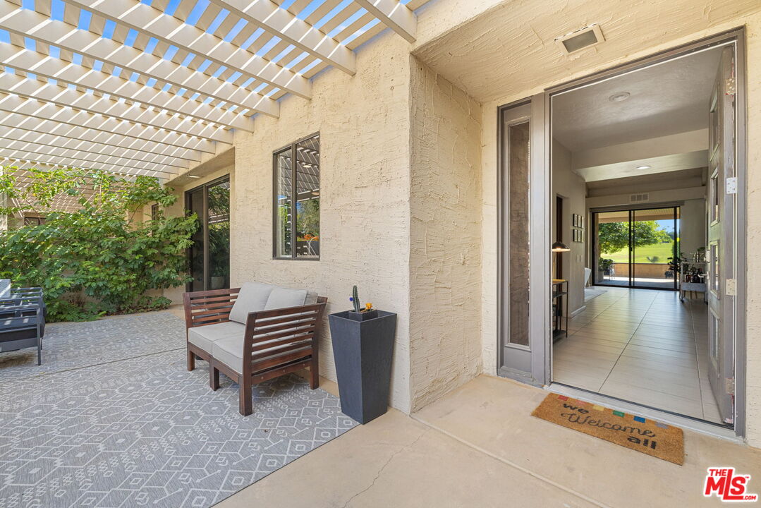 155 Desert W Drive Rancho Mirage, CA 92270 - Photo 6 of 50 a view of outdoor space with porch and wooden floor