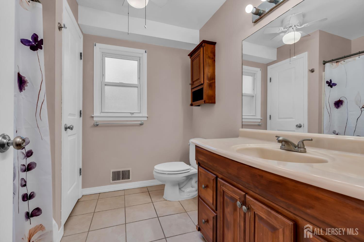 120 Cedar Swamp Road Jackson, NJ 08527 - Photo 13 of 39 a bathroom with a granite countertop sink a toilet and a mirror