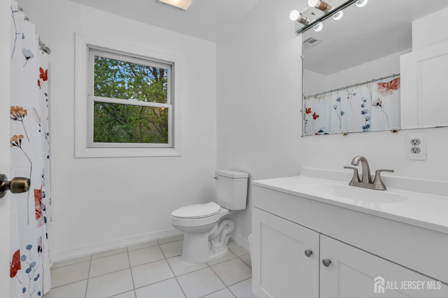 120 Cedar Swamp Road Jackson, NJ 08527 - Photo 17 of 39 a bathroom with a sink toilet and a window