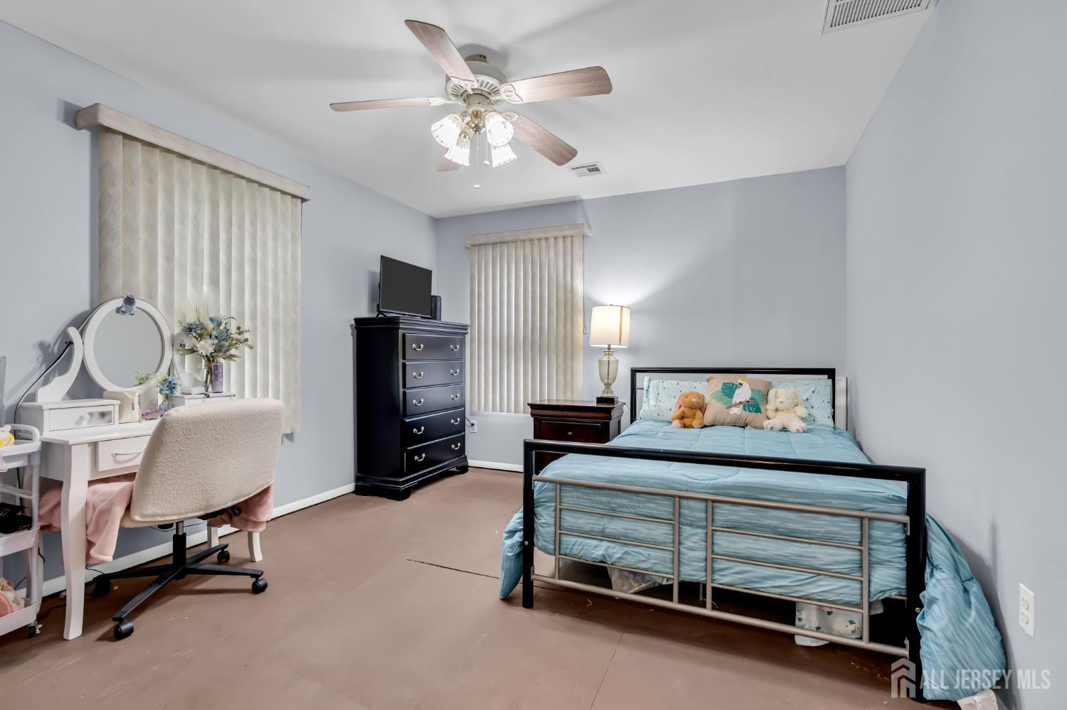 120 Cedar Swamp Road Jackson, NJ 08527 - Photo 24 of 39 a bedroom with a bed and a chandelier
