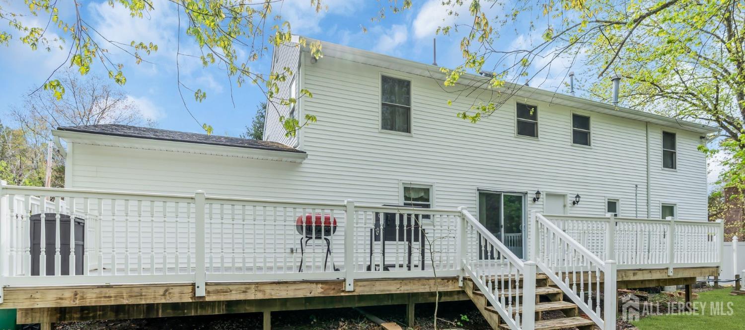 120 Cedar Swamp Road Jackson, NJ 08527 - Photo 38 of 39 a view of a house with a balcony and wooden stairs