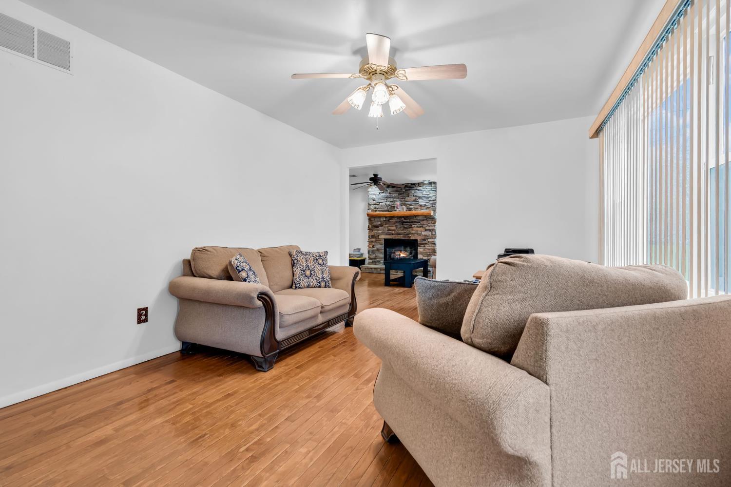 120 Cedar Swamp Road Jackson, NJ 08527 - Photo 10 of 39 a living room with furniture and a large window
