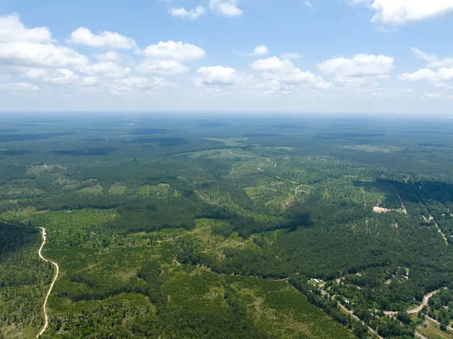 a view of a lake with a yard