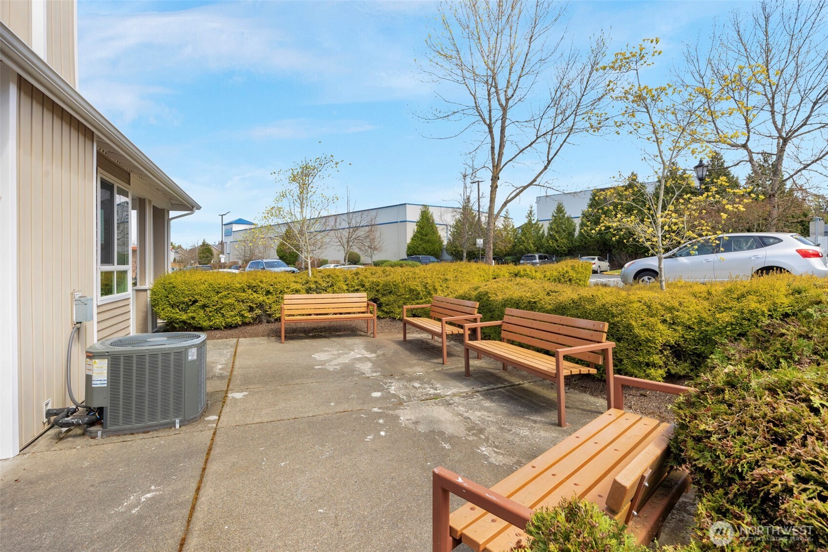 14915 38th Drive Southeast, Unit 3025 Bothell, WA 98012 - Photo 29 of 35 a view of a backyard with lawn chairs and a fire pit
