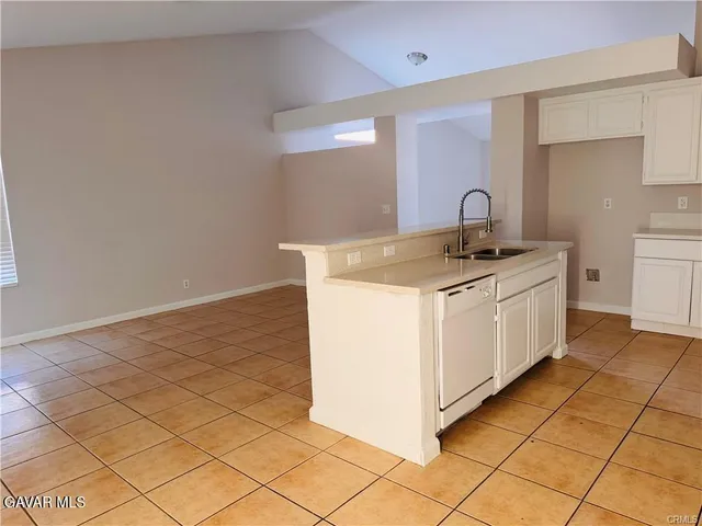 a utility room with a sink washer and dryer