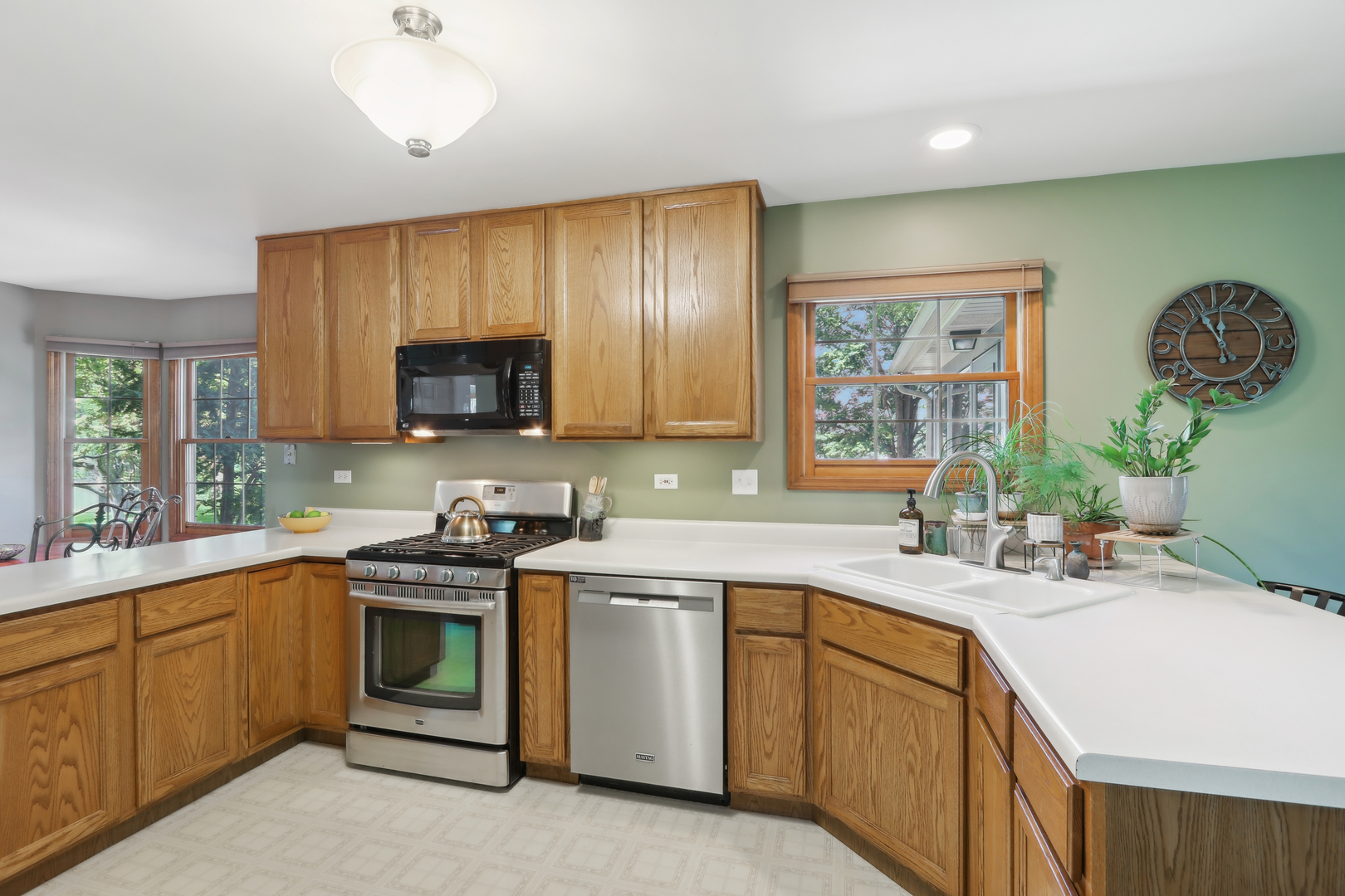 2835 Randall Ridge Court Elgin, IL 60124 - Photo 11 of 39 a kitchen with a sink stove and microwave