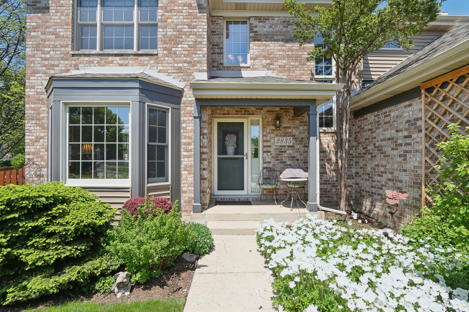 2835 Randall Ridge Court Elgin, IL 60124 - Photo 3 of 39 front view of a brick house with a large windows