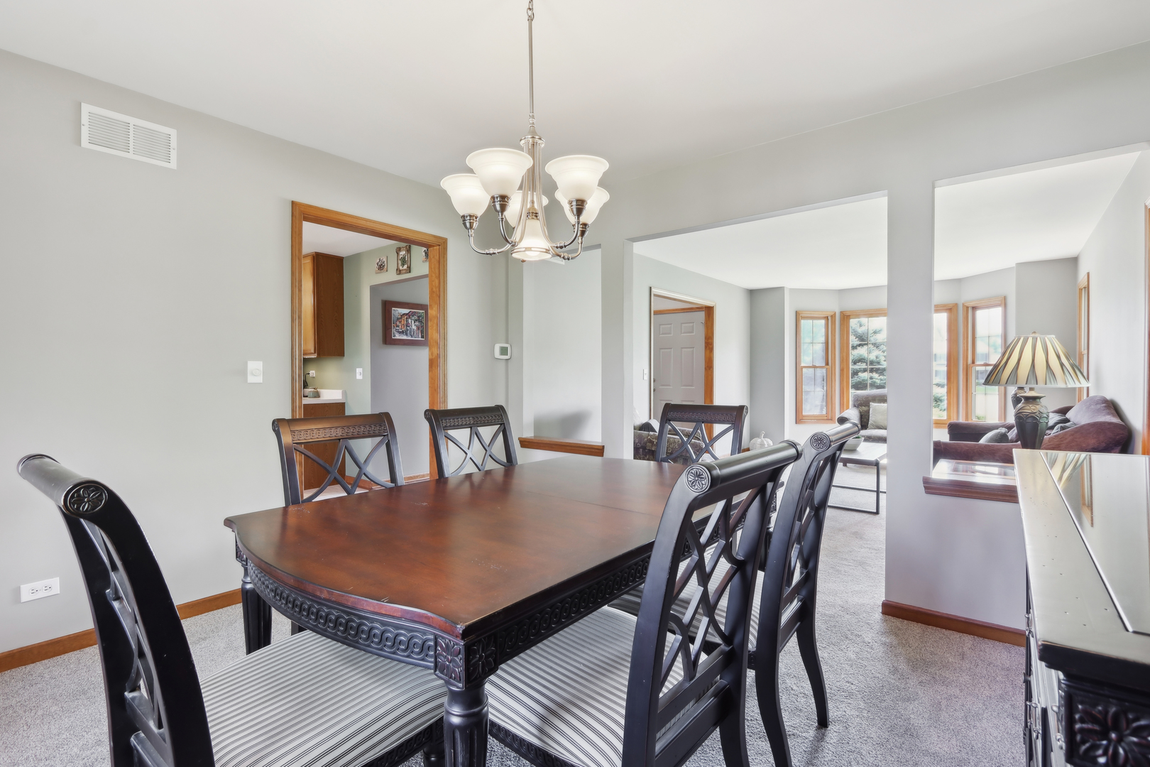 2835 Randall Ridge Court Elgin, IL 60124 - Photo 7 of 39 a view of a dining room with furniture and wooden floor