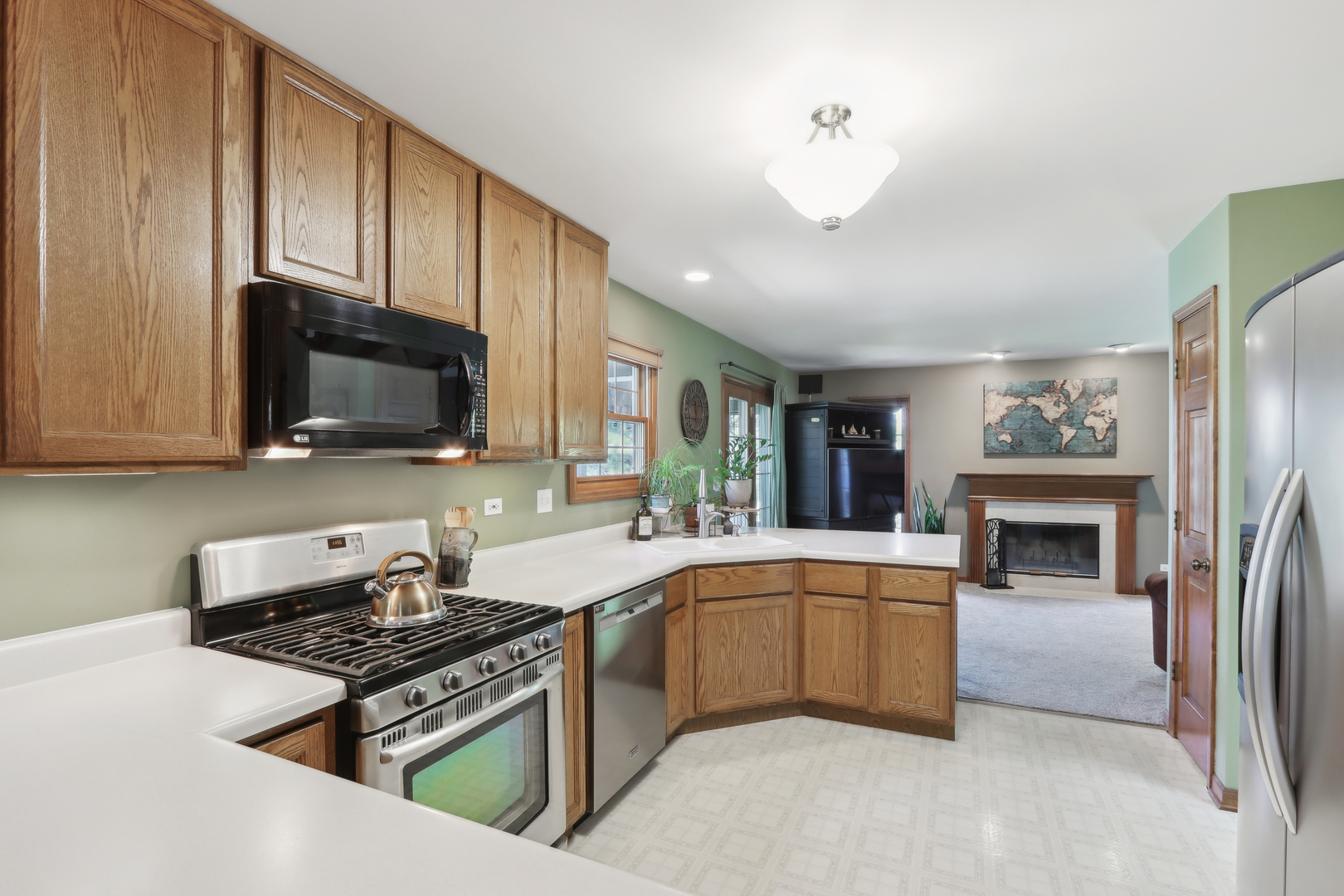 2835 Randall Ridge Court Elgin, IL 60124 - Photo 10 of 39 a kitchen with stainless steel appliances granite countertop a stove top oven a sink dishwasher a refrigerator and a stove