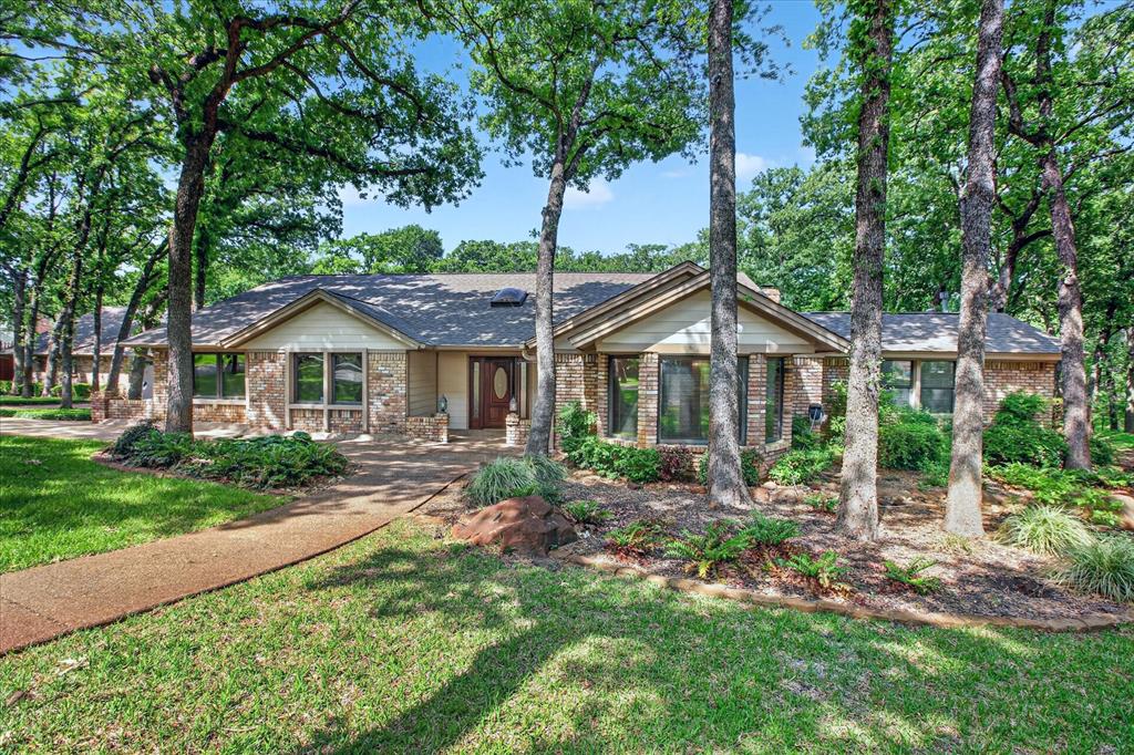 1607 North Main Street Euless, TX 76039 - Photo 4 of 39 a front view of a house with yard and green space