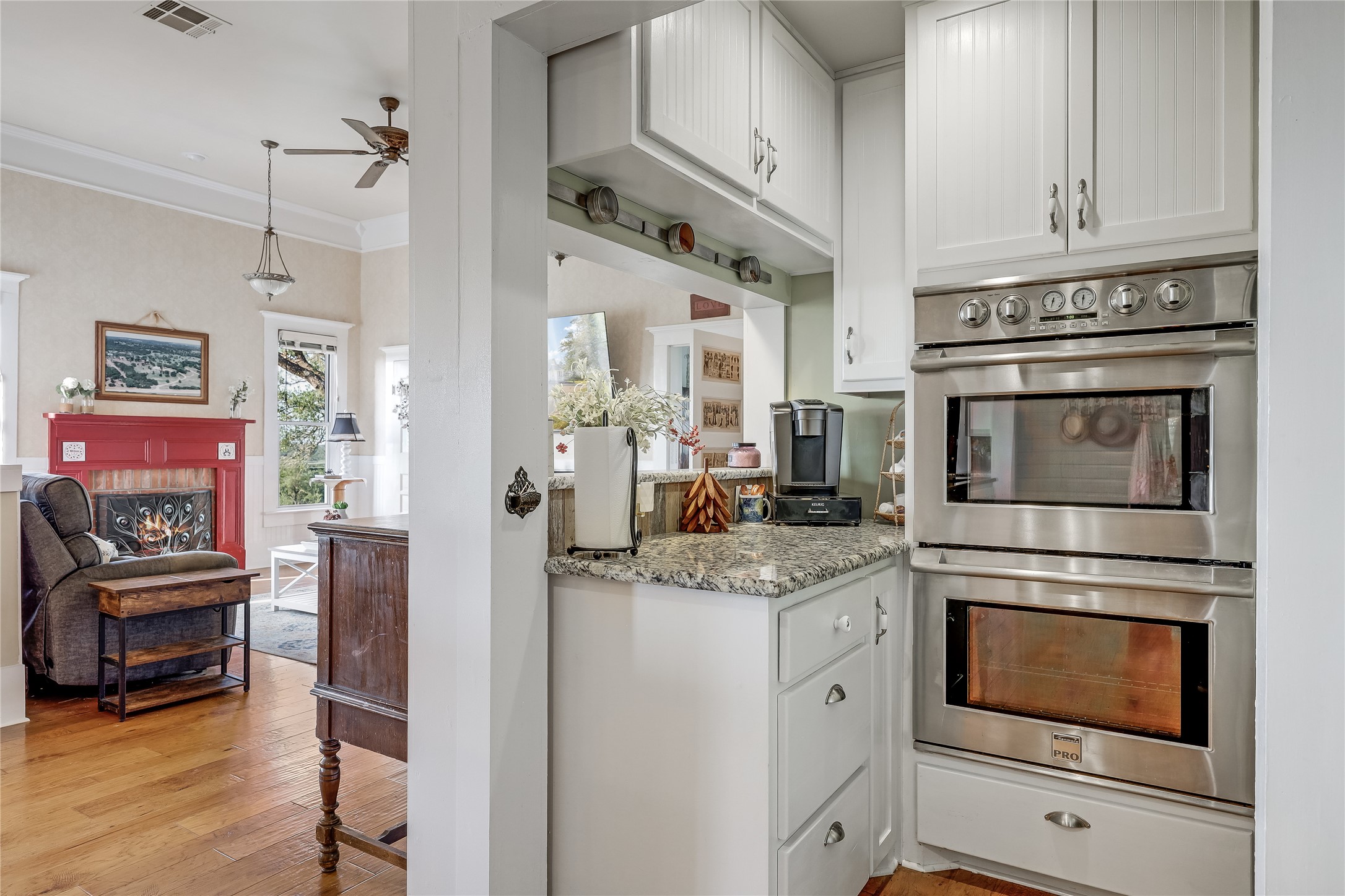 13471 Cedar Valley Road Salado, TX 76571 - Photo 10 of 39 a kitchen with stainless steel appliances granite countertop a stove and a refrigerator