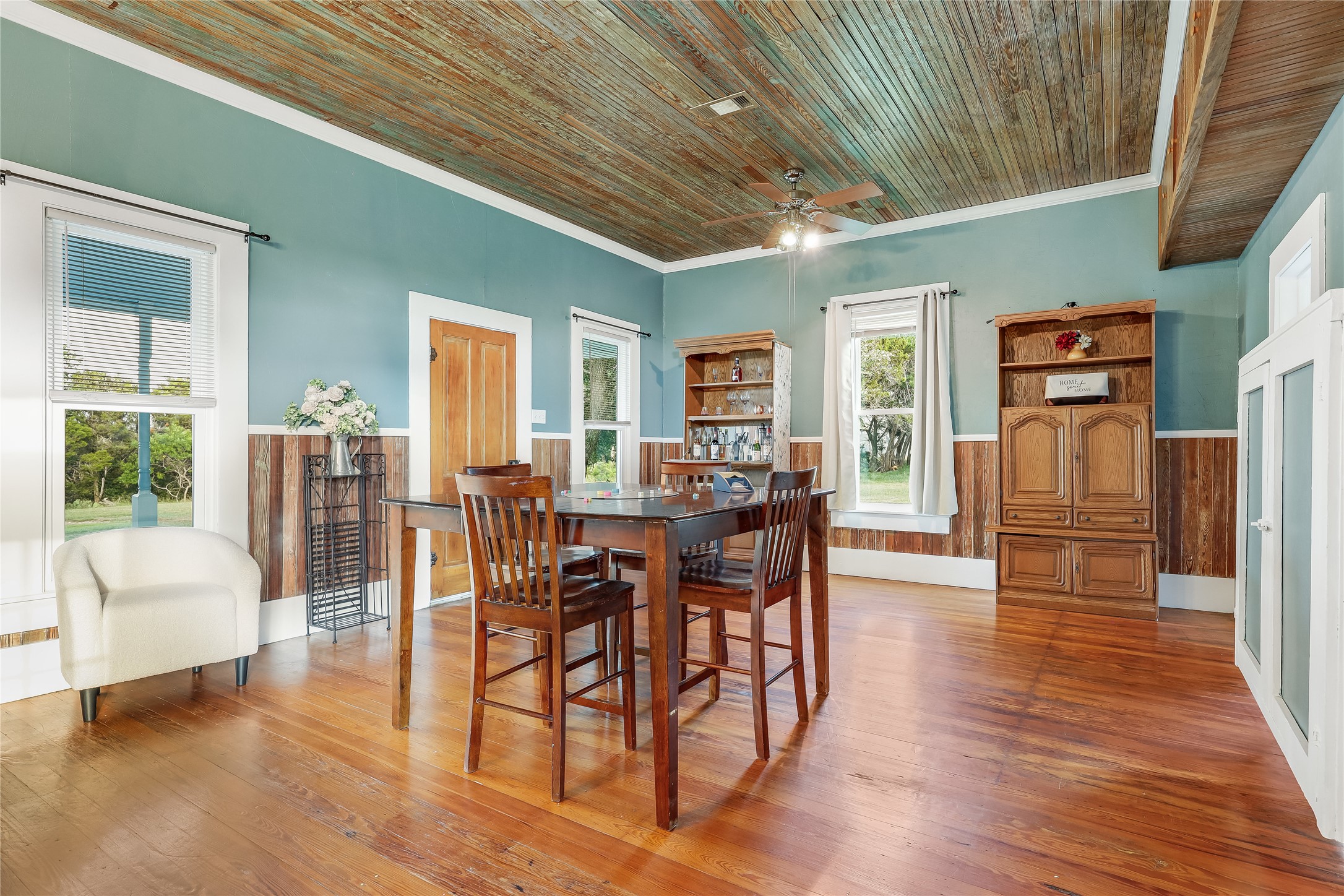 13471 Cedar Valley Road Salado, TX 76571 - Photo 21 of 39 a view of a dining room with furniture and wooden floor