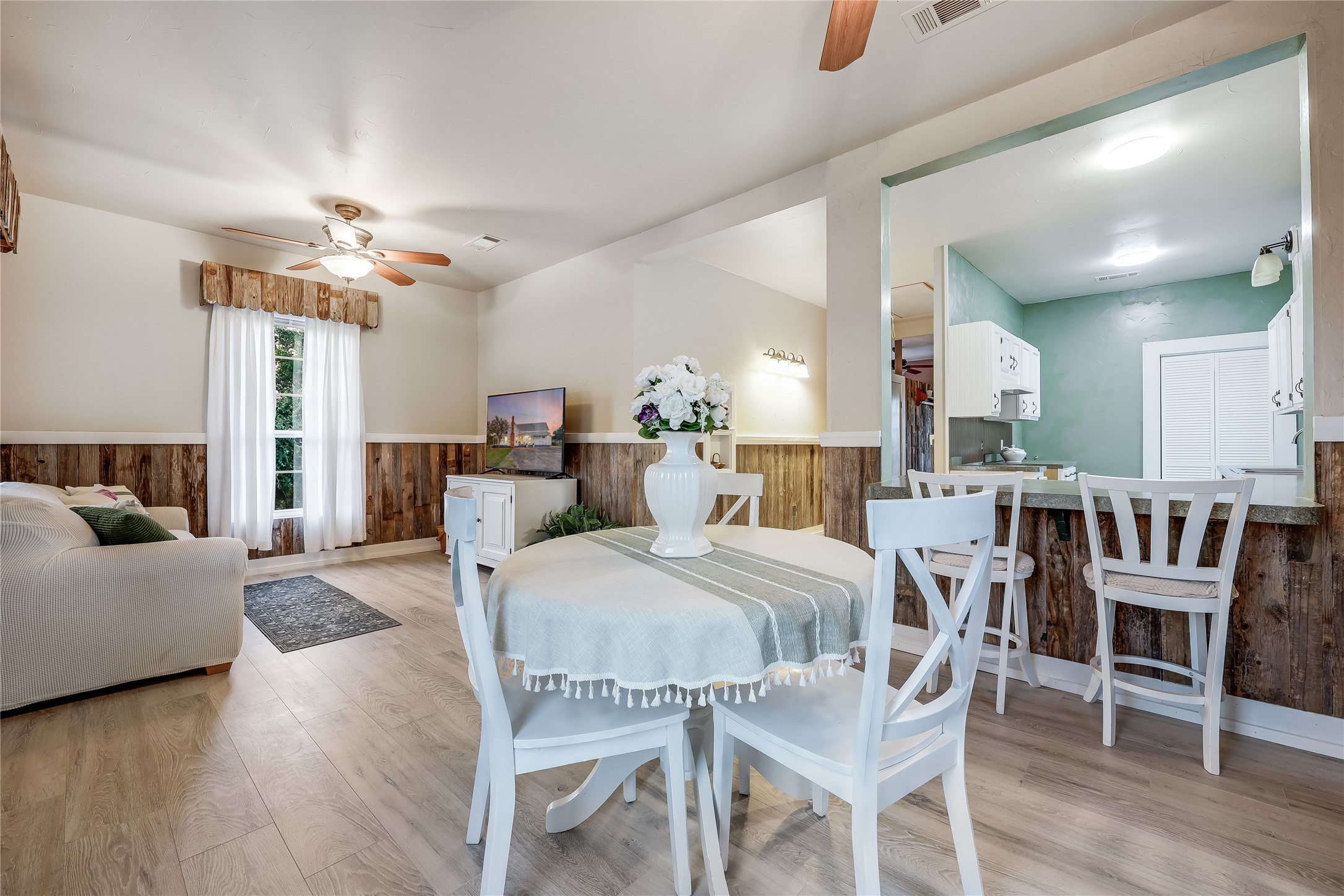 13471 Cedar Valley Road Salado, TX 76571 - Photo 31 of 39 a view of a dining room with furniture and wooden floor