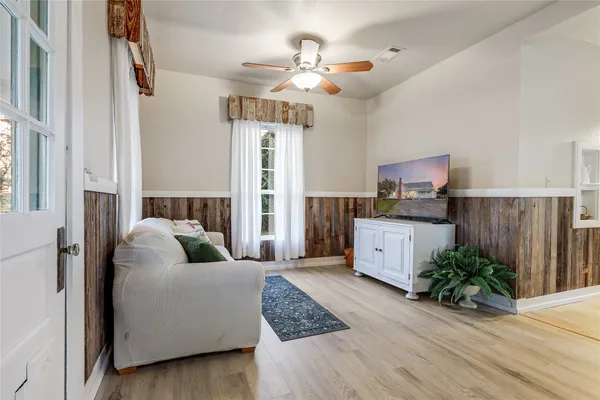 a view of a dining room with furniture and wooden floor