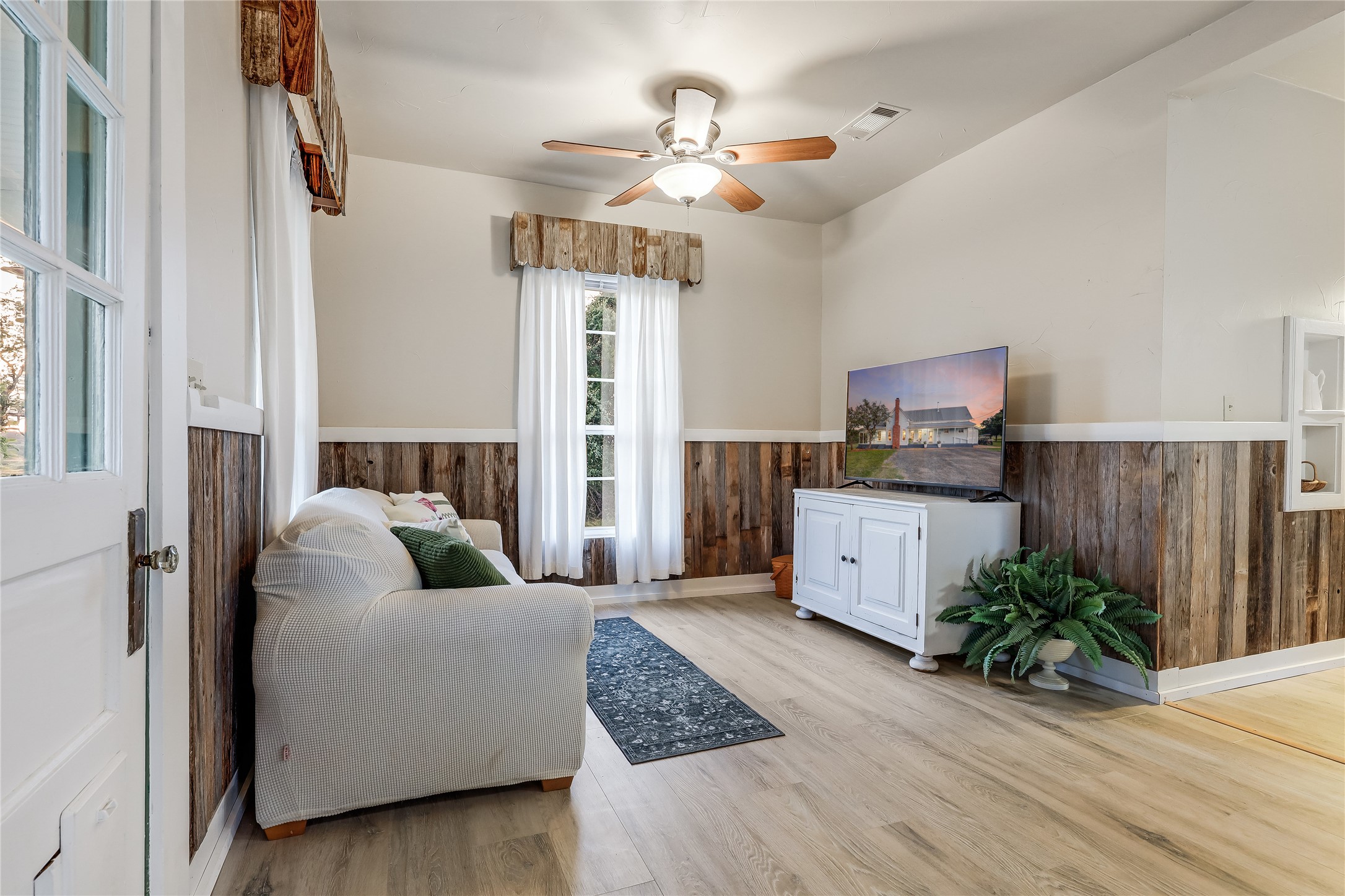 13471 Cedar Valley Road Salado, TX 76571 - Photo 32 of 39 a living room with furniture and wooden floor