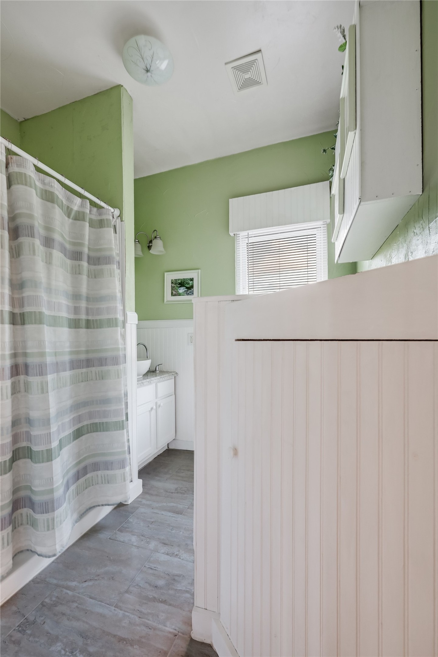 13471 Cedar Valley Road Salado, TX 76571 - Photo 35 of 39 a bathroom with a shower and a sink