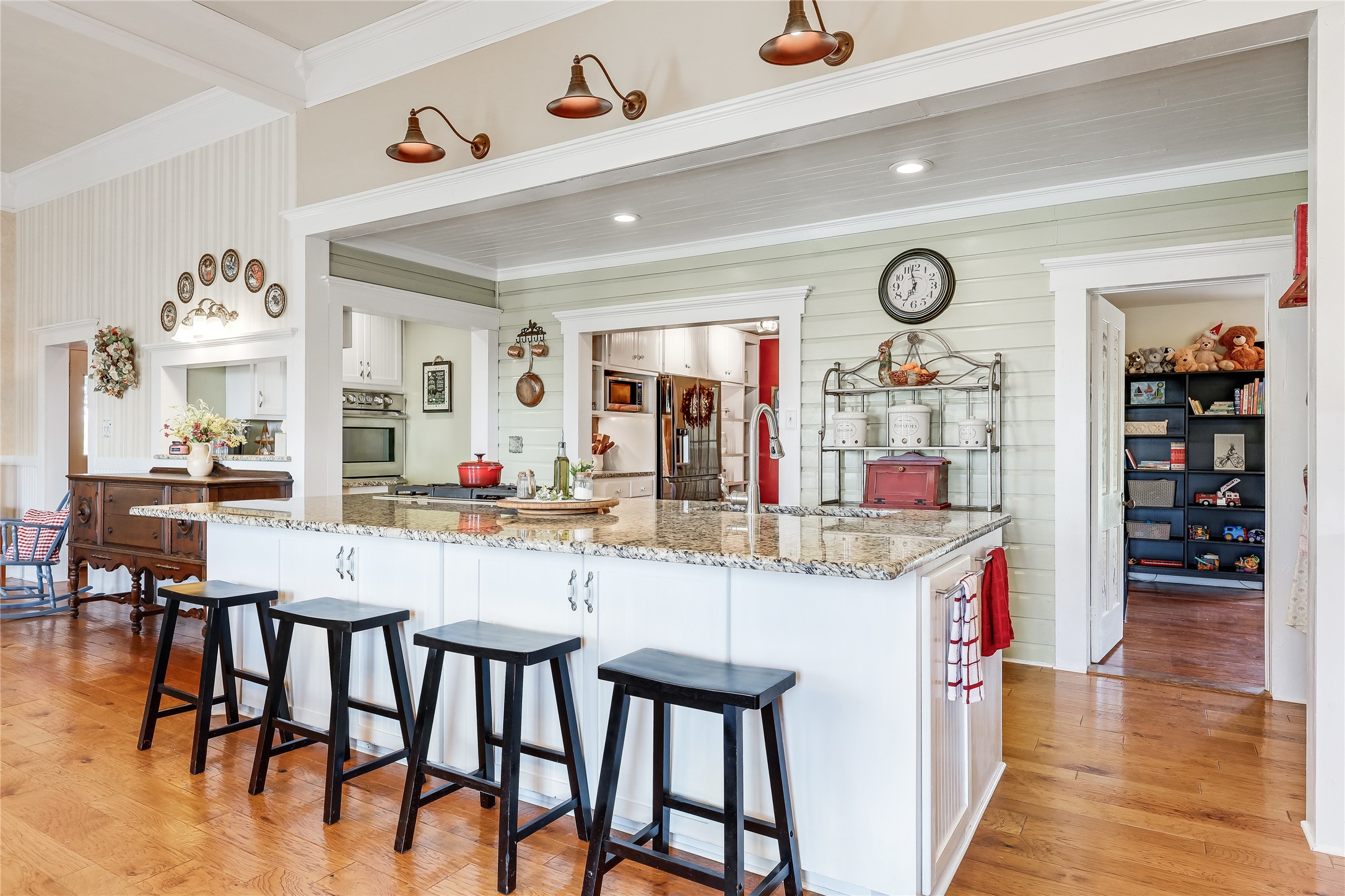 13471 Cedar Valley Road Salado, TX 76571 - Photo 7 of 39 a kitchen with stainless steel appliances kitchen island granite countertop a table and chairs in it