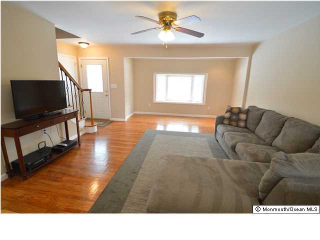 955 Hyson Road Jackson, NJ 08527 - Photo 2 of 15 a living room with furniture and a flat screen tv