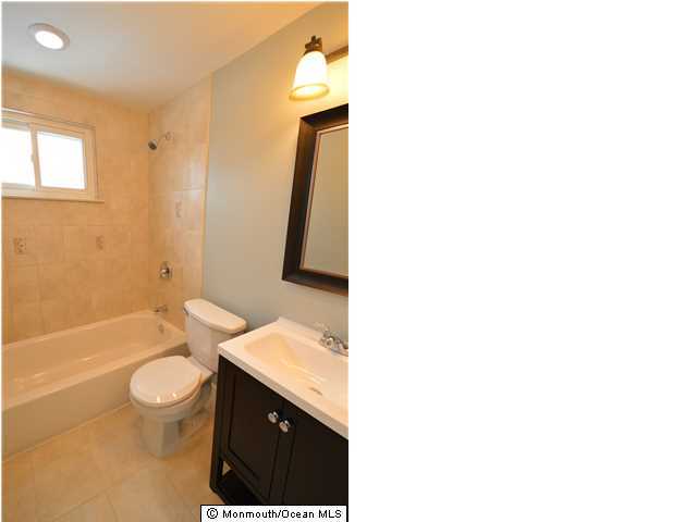 955 Hyson Road Jackson, NJ 08527 - Photo 13 of 15 a bathroom with a sink a toilet and shower
