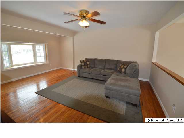 955 Hyson Road Jackson, NJ 08527 - Photo 3 of 15 a living room with furniture and a flat screen tv