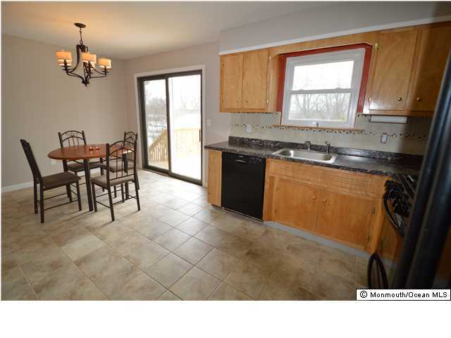 955 Hyson Road Jackson, NJ 08527 - Photo 4 of 15 a kitchen with granite countertop a sink cabinets and window