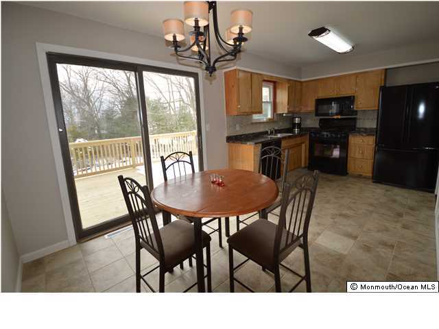 955 Hyson Road Jackson, NJ 08527 - Photo 6 of 15 a view of a dining room with furniture window and outside view